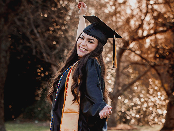 An image of Vertex Foundation Scholarship winner Monserrat Tejeda-Munoz smiling in a graduation cap and gown